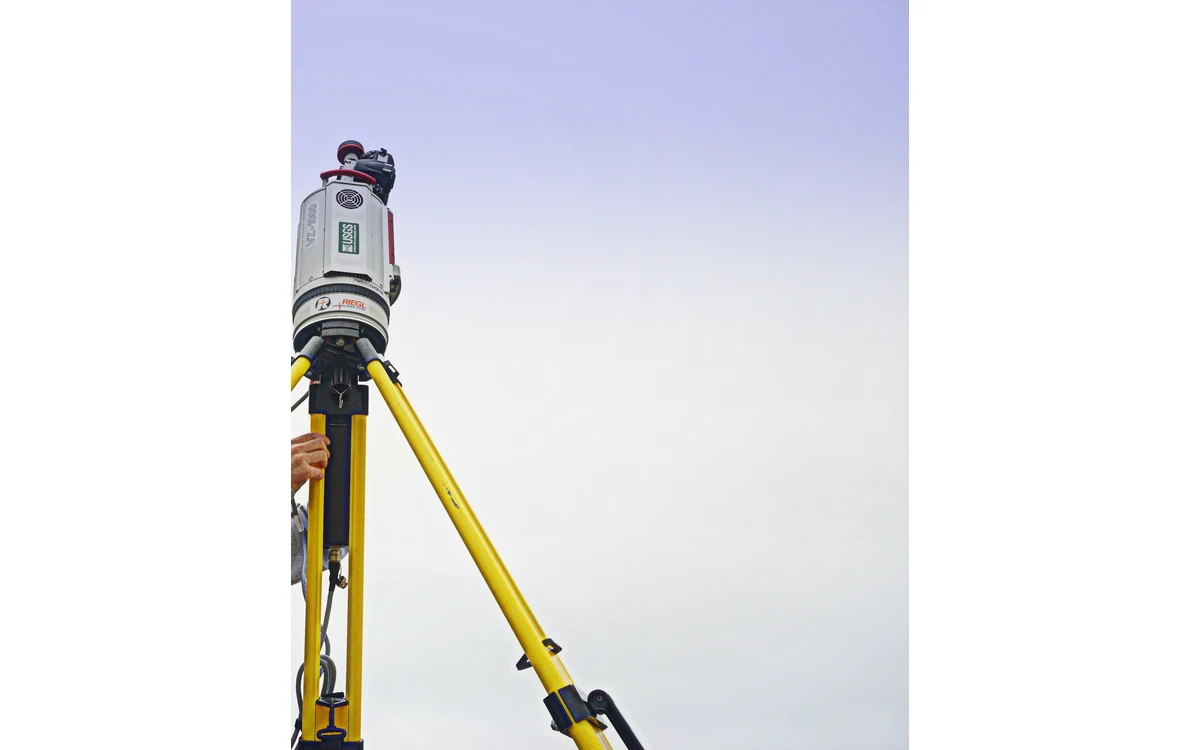 Terrestrial LiDAR scanner and tripod in a cropped USGS field photograph.