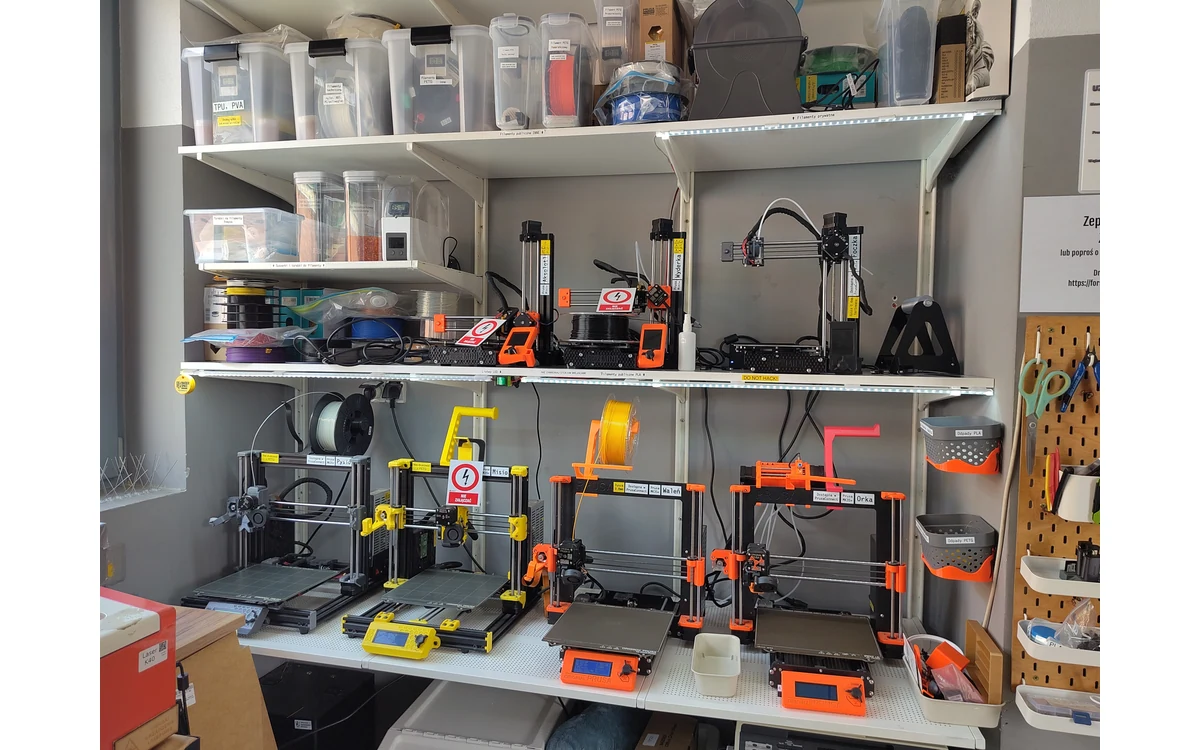 Filament printers, reels, and storage containers at Hackerspace Wroclaw