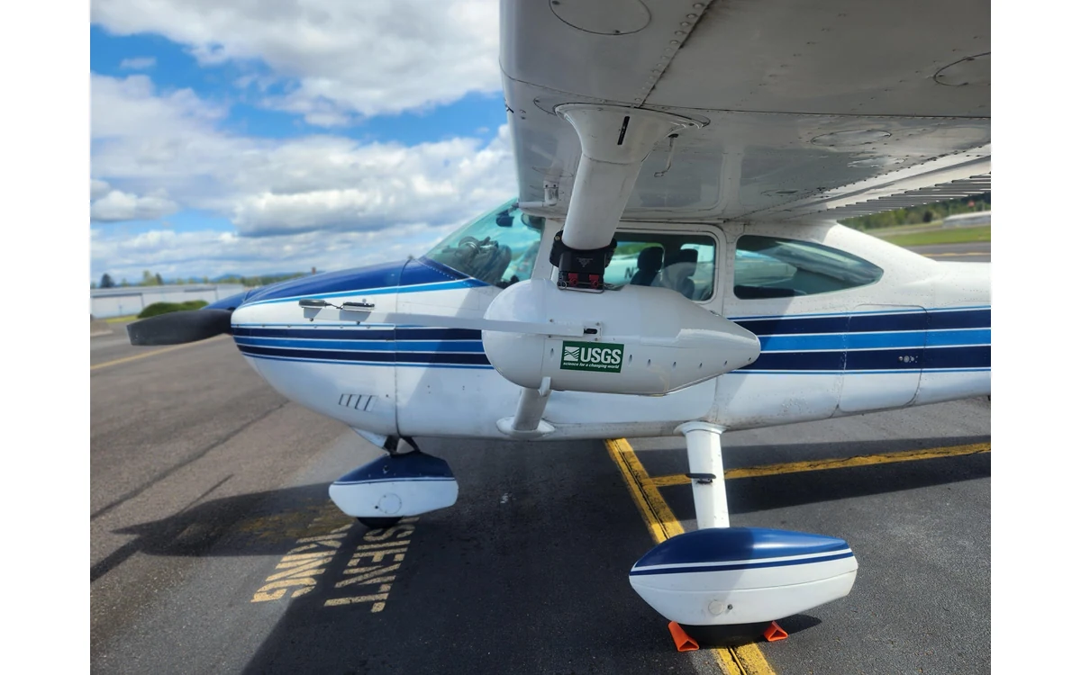 Crewed Cessna 182 fitted with a USGS multispectral camera system for river research.